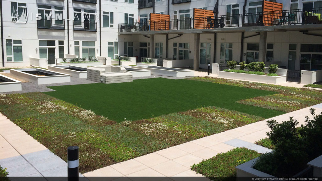 Lounge area of an apartment complex with artificial grass