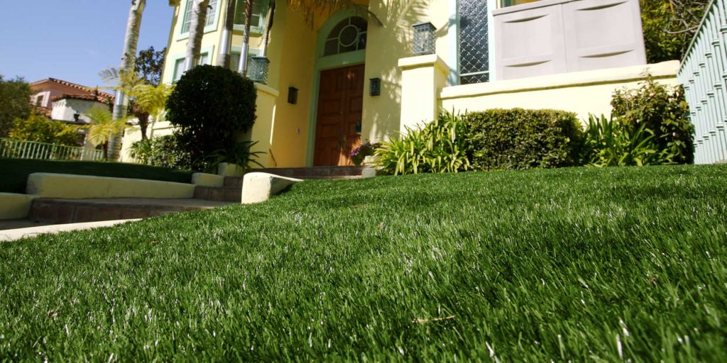 Front yard with artificial grass installed